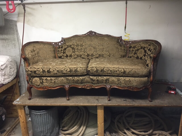 reupholstered green antique sofa