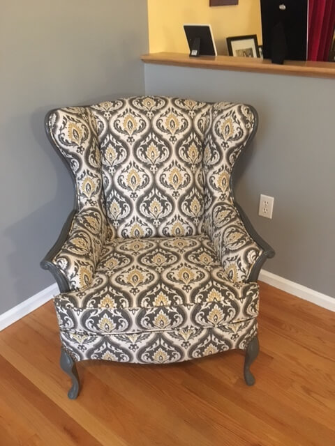 slipcovered chair in corner