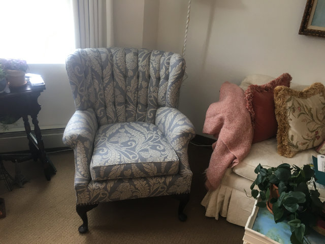gray and white upholstered chair