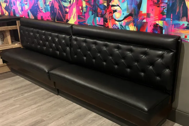 Restaurant black custom upholstered console.